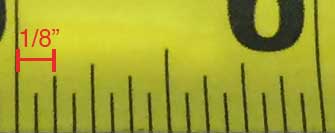 photo showing the second smallest markings on a tape measure representing one-eighth of an inch