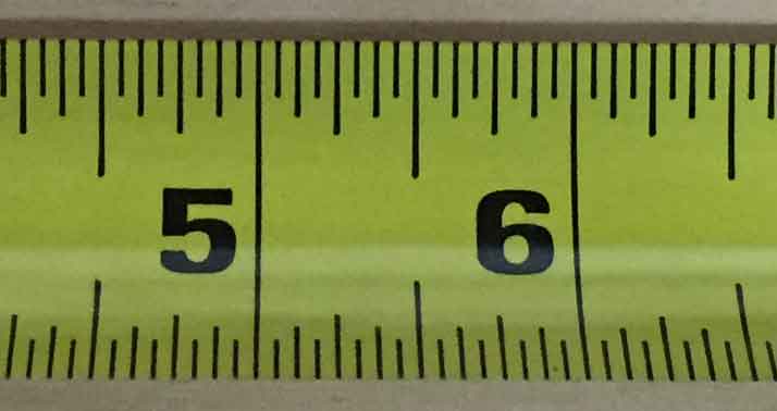 photo showing the largest markings on a tape measure representing one inch increments.