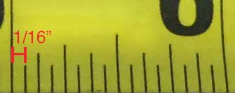 photo showing the smallest markings on a tape measure representing one-sixteenth of an inch