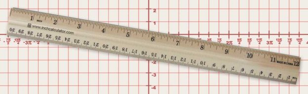 A 12" wooden desk ruler and graph paper