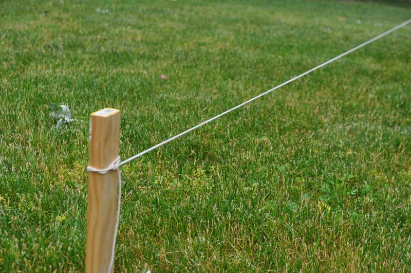 String attached to fence layout stake to locate the fence line