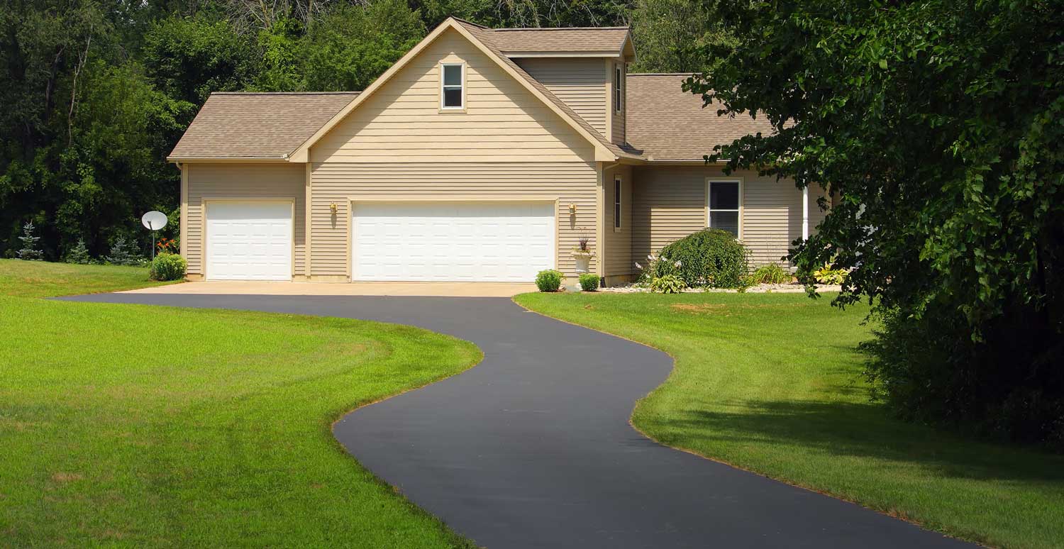 A new winding asphalt driveway