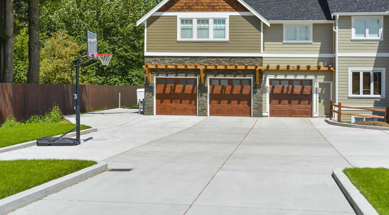 New concrete driveway in front of a home