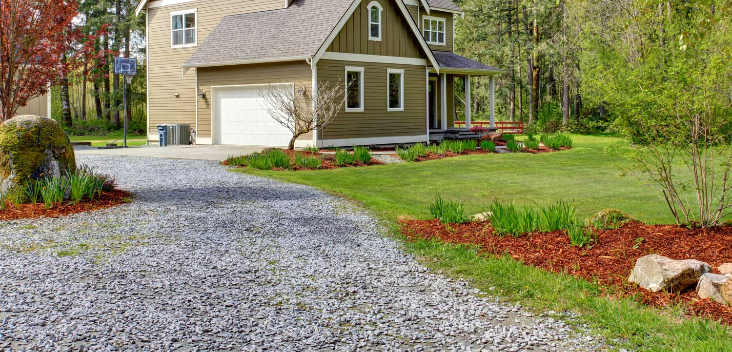 long gravel driveway at a country home