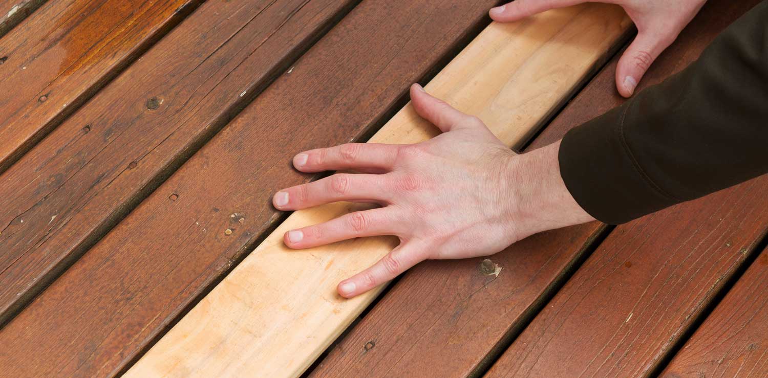 Deck with repaired deck boards