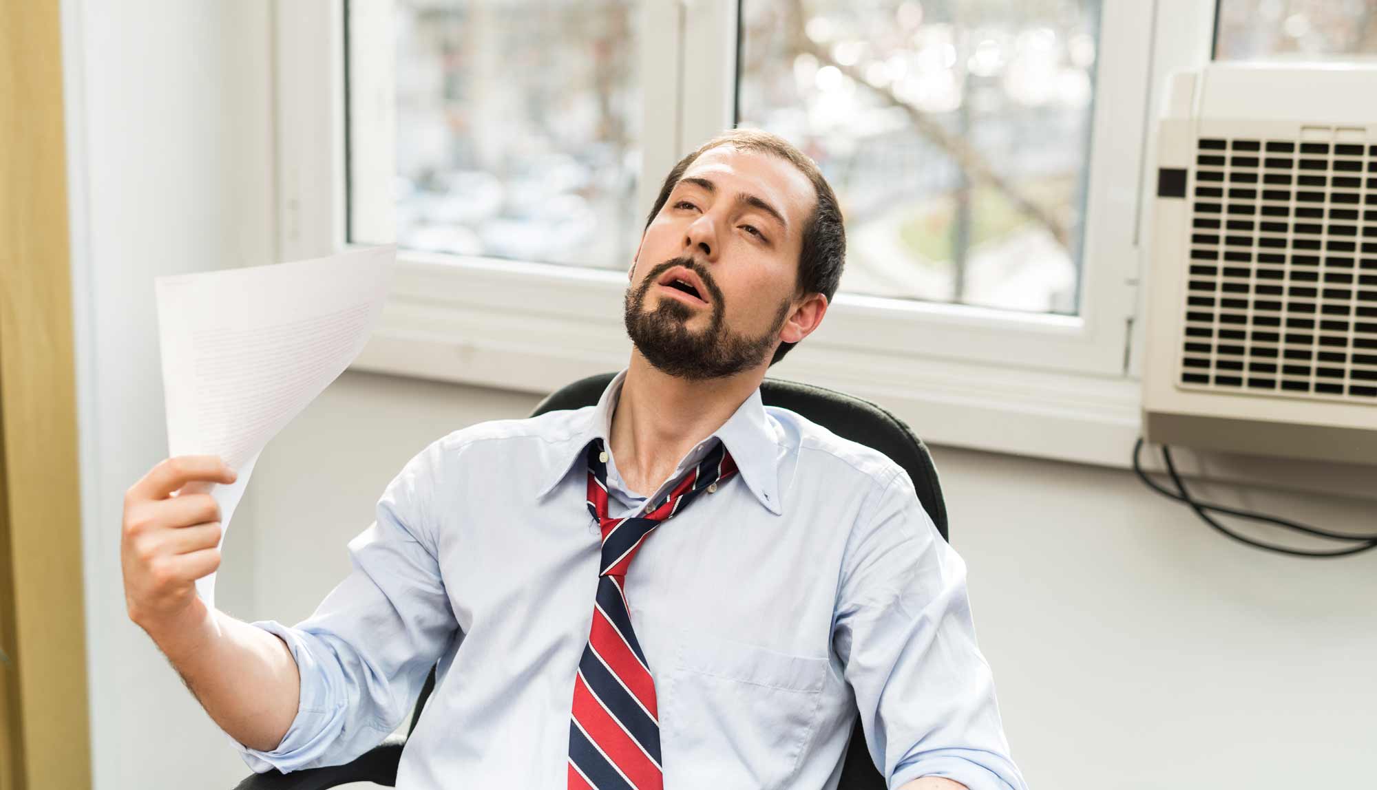 Hot office with a broken window air conditioner