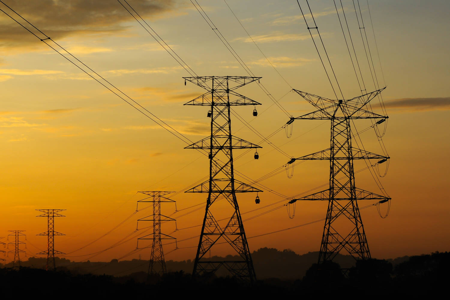 Electrical power lines in the sunset