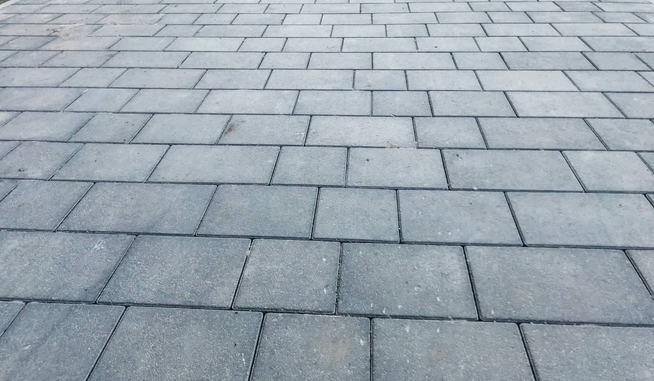 New paver driveway using grey concrete pavers