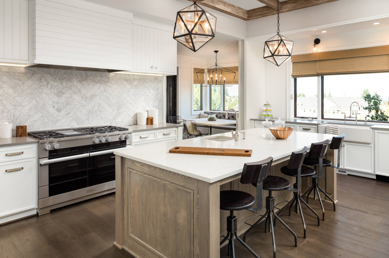 Newly renovated kitchen with new cabinets, countertops, and backsplash