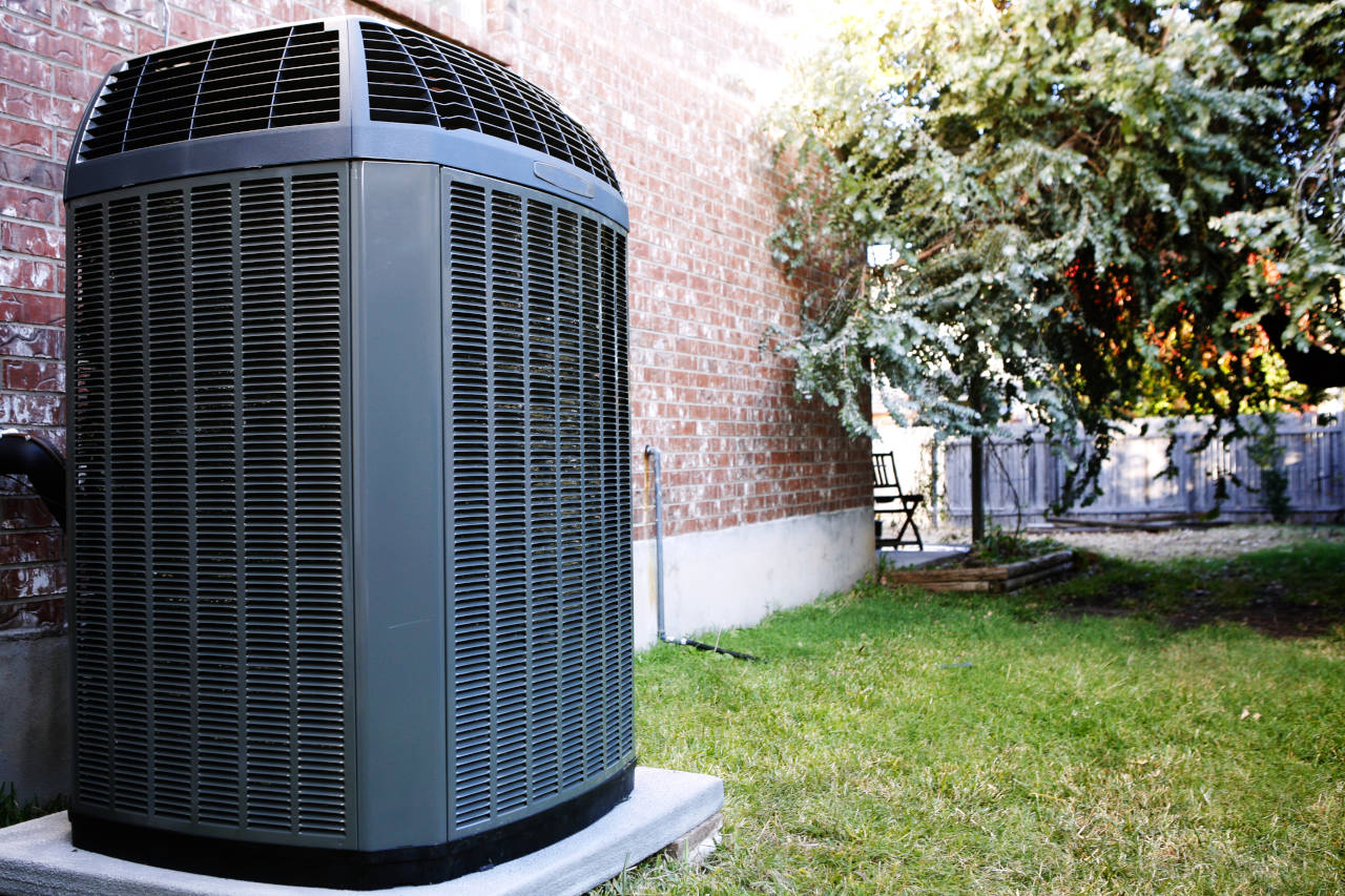 newly installed heat pump next to a home