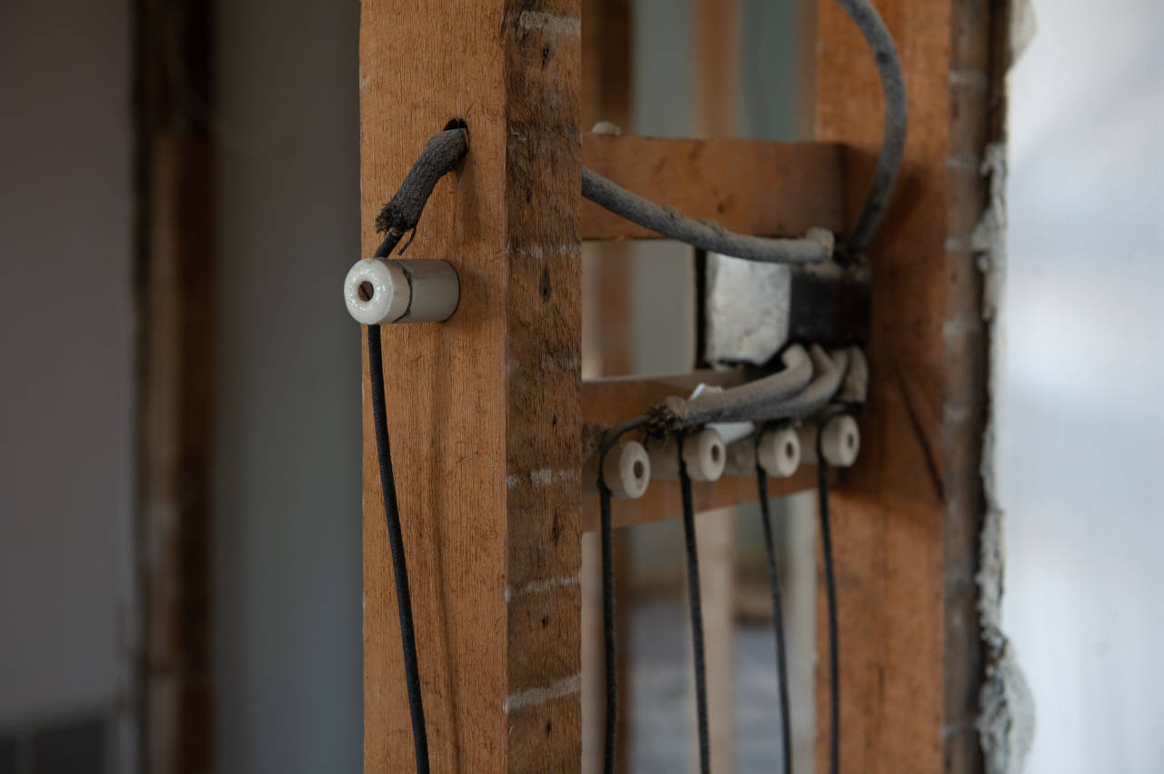 knob and tube wiring behind the walls of an old home