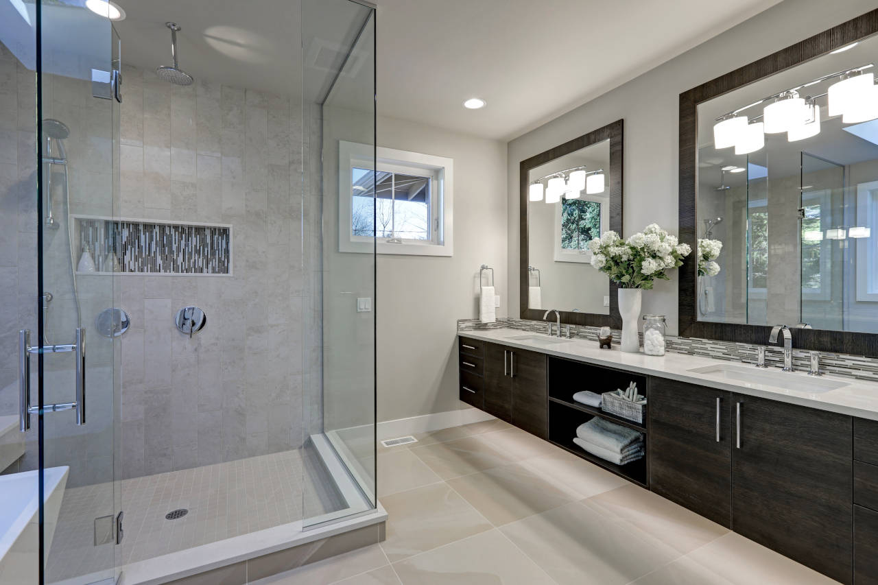 bathroom shower with frameless glass surround