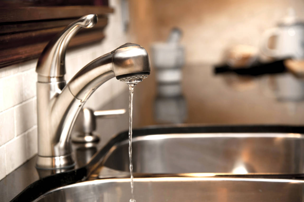 kitchen faucet installed with a stainless steel sink