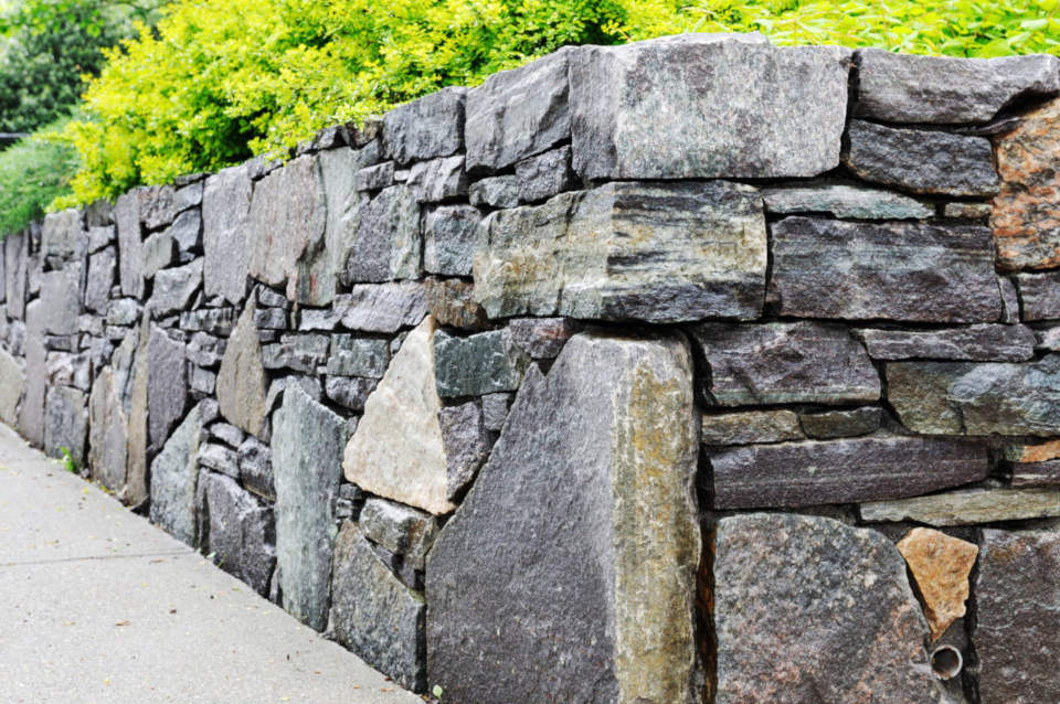 Stone retaining walls are beautiful but materials are usually more expensive