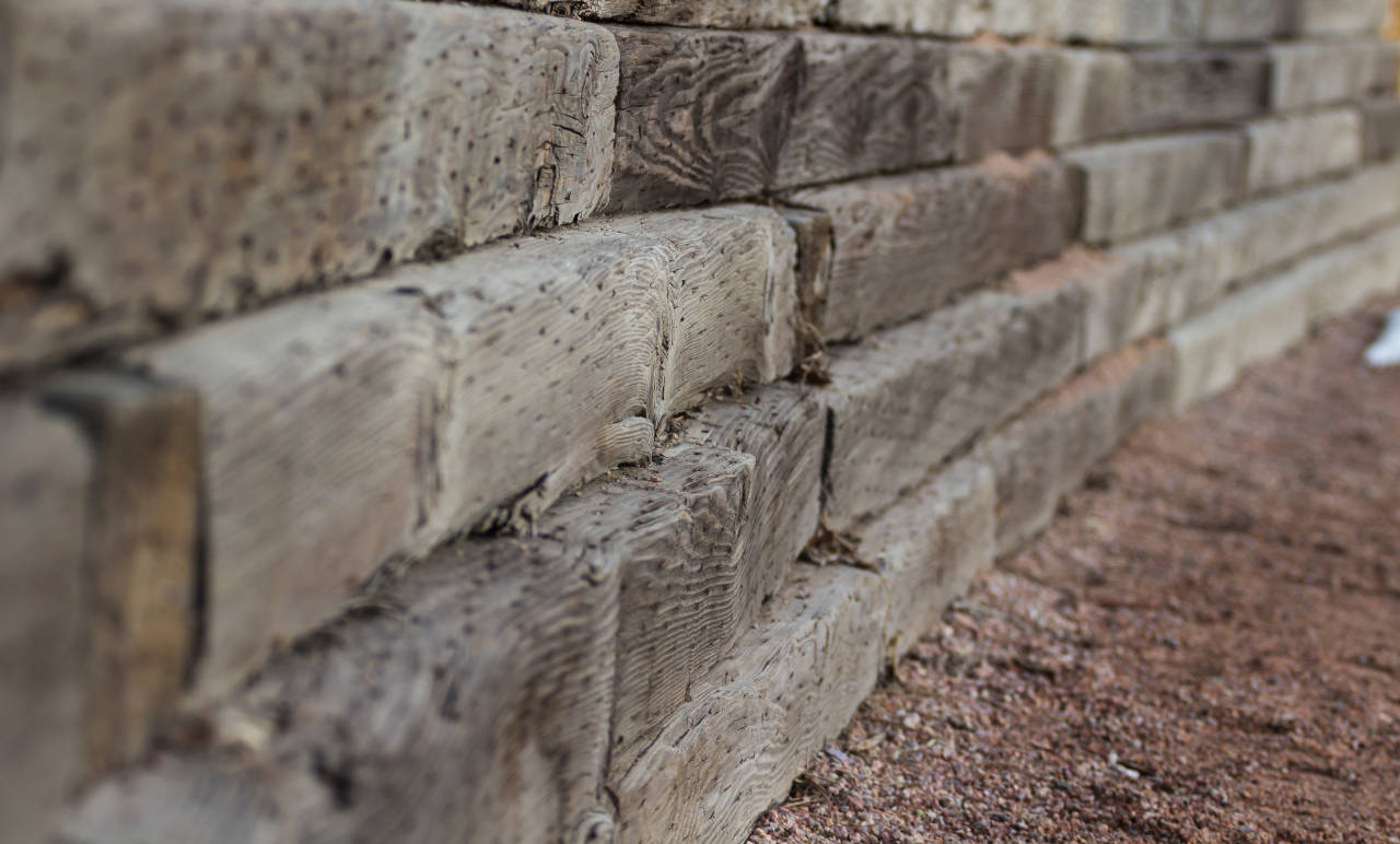 Retaining wall constructed from wood timbers