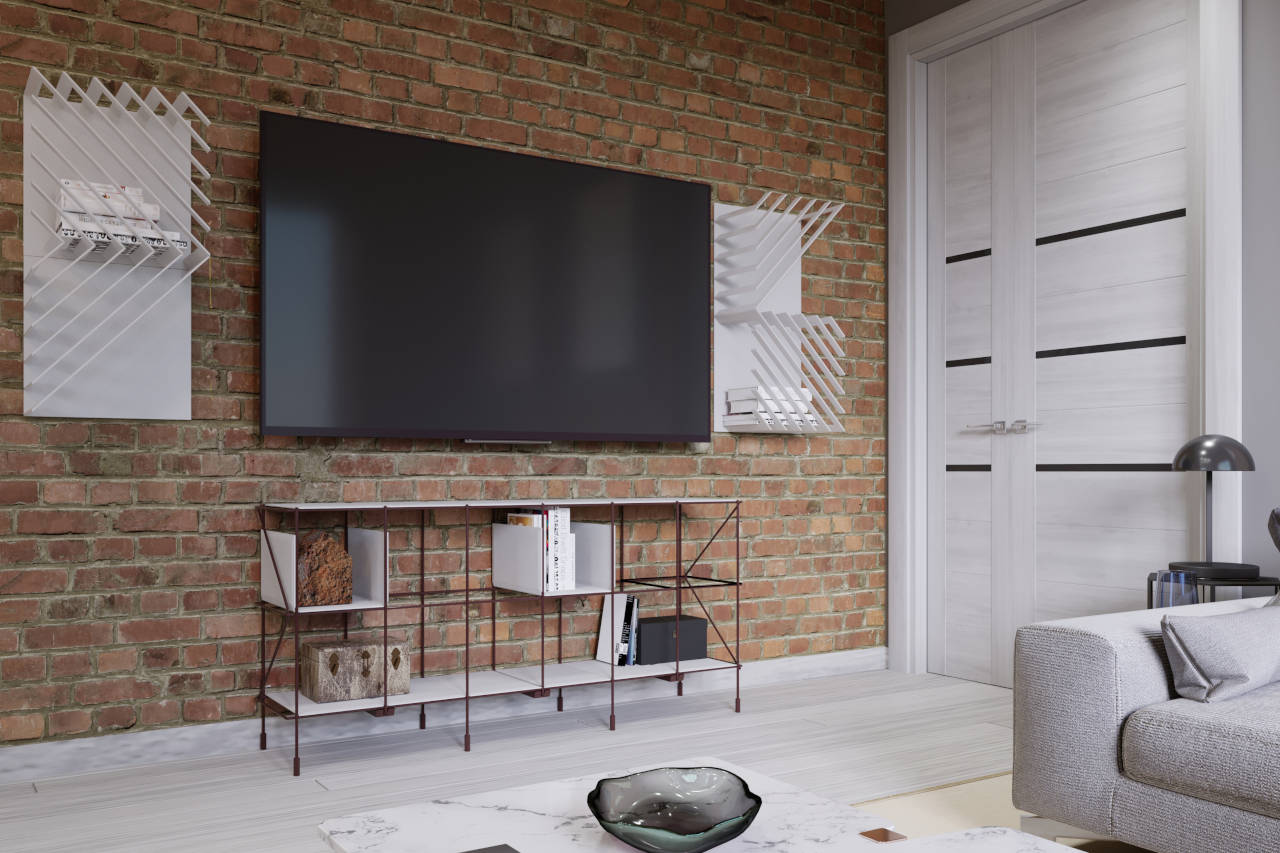 flat screen television flush mounted on a brick wall