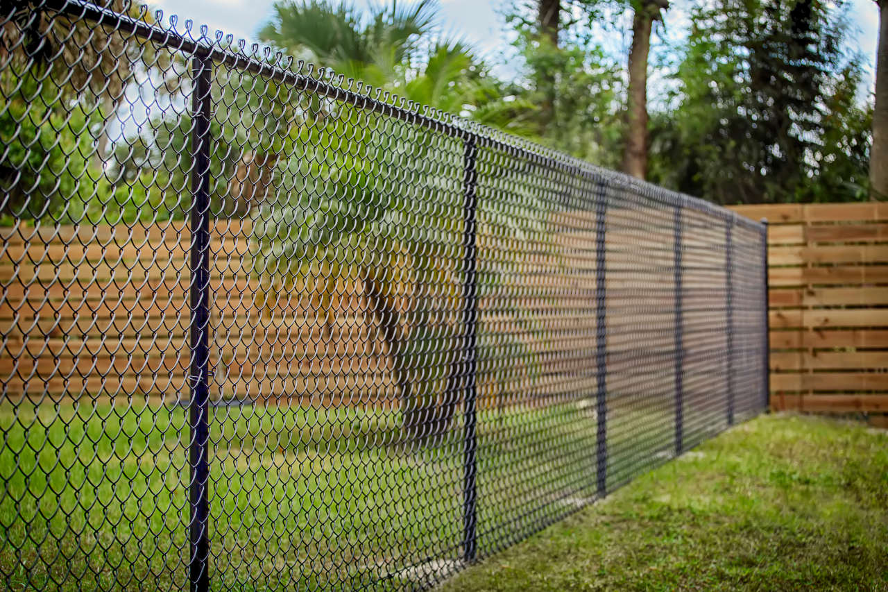 Chain link is a very cost effective material choice for a fence