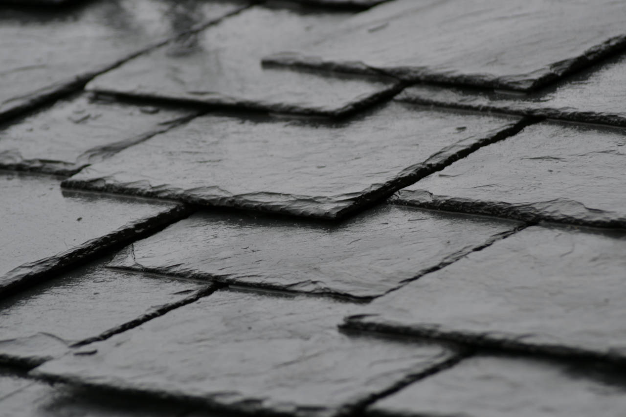 Roof installed with black slate shingles