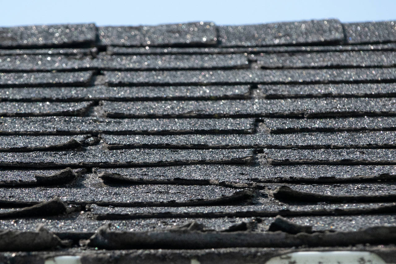 shingles on a roof that are curling