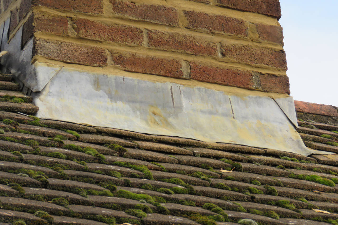 flashing that is worn and separating from the chimney