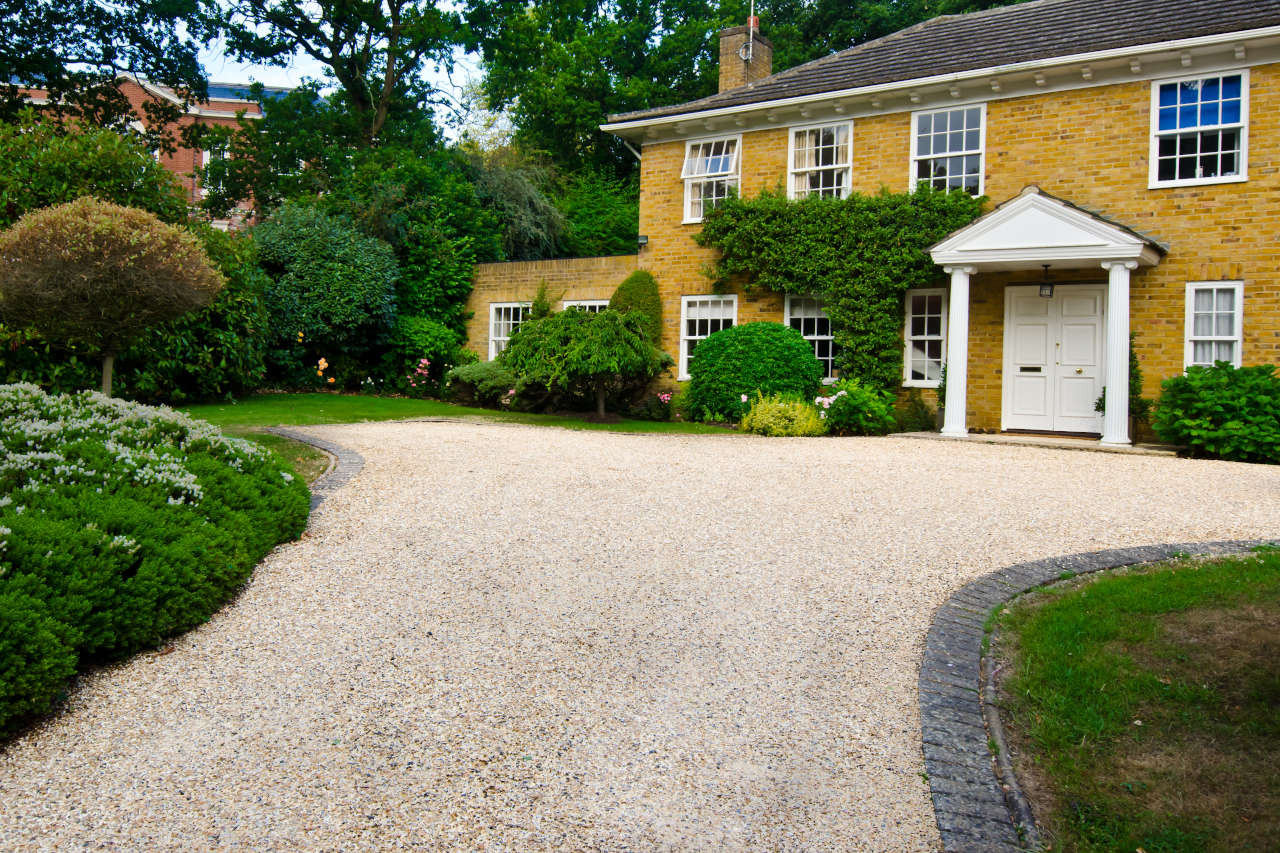 Gravel driveway consisting of a 6-8 inch bed of crushed stone