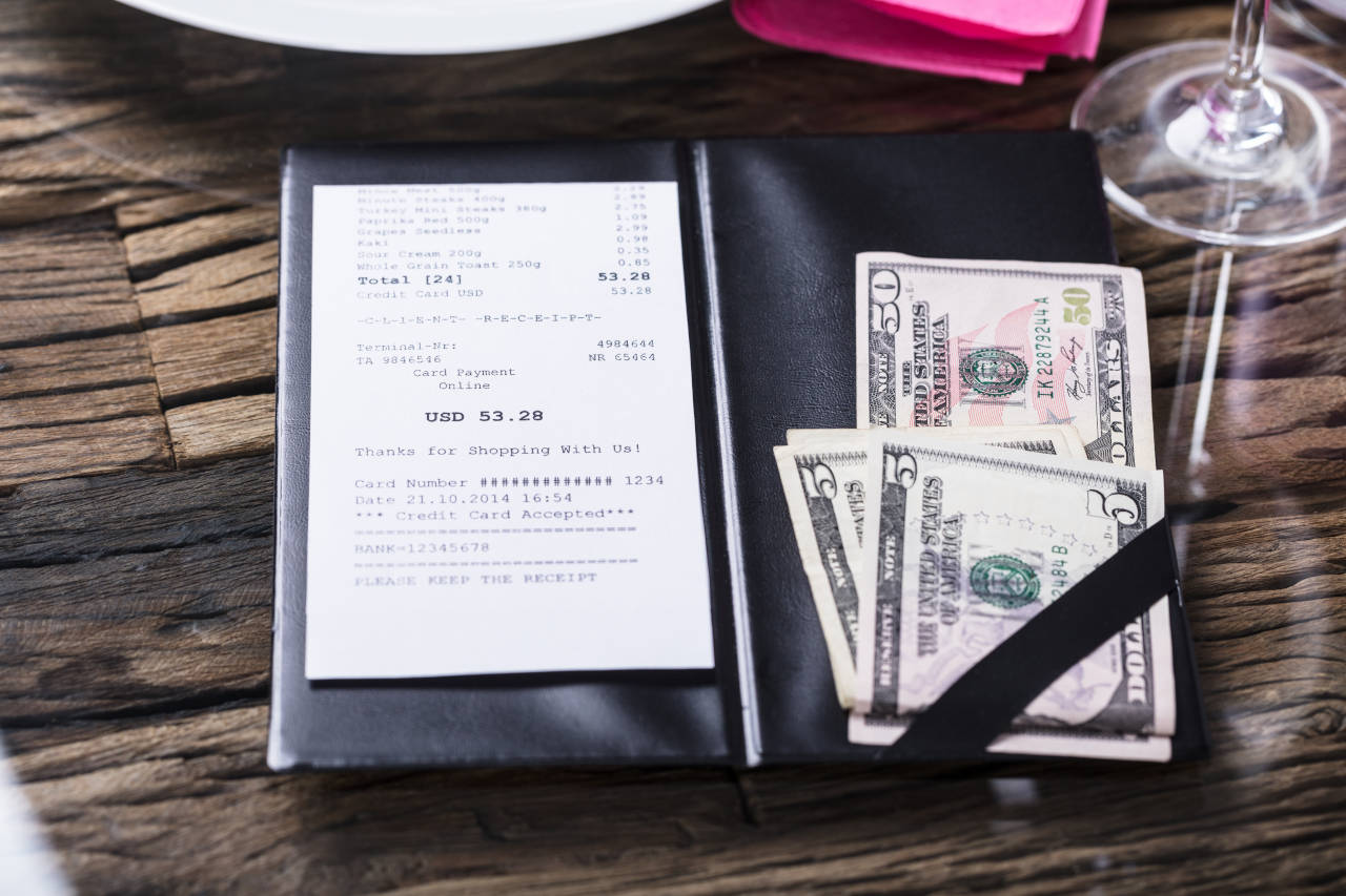 Cash tip left for a restaurant bill